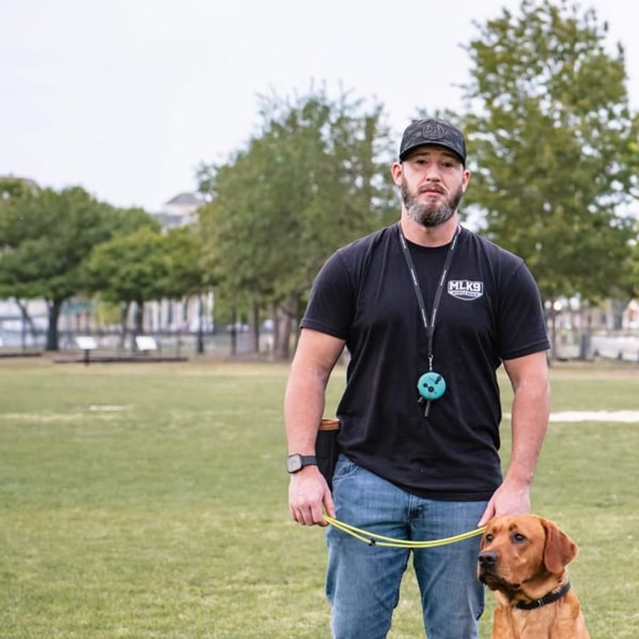 Aaron Hans, Owner and Lead Trainer at MLK9 Myrtle Beach, with his red fox lab